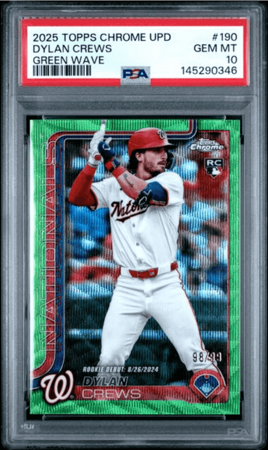 PSA-graded baseball card in clear holder showing Dylan Crews in batting stance wearing red Nationals uniform against green wave background.
