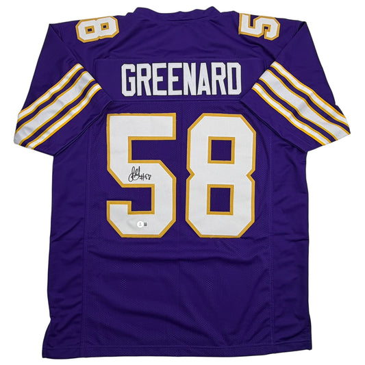 Purple Minnesota Vikings football jersey number 58 with "GREENARD" nameplate, displayed flat showing back view with white and gold trim and autograph.