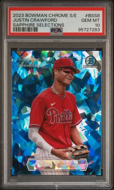 PSA-graded baseball card featuring Justin Crawford in red Phillies uniform against blue crystalline background, with red label and grade details visible at top.