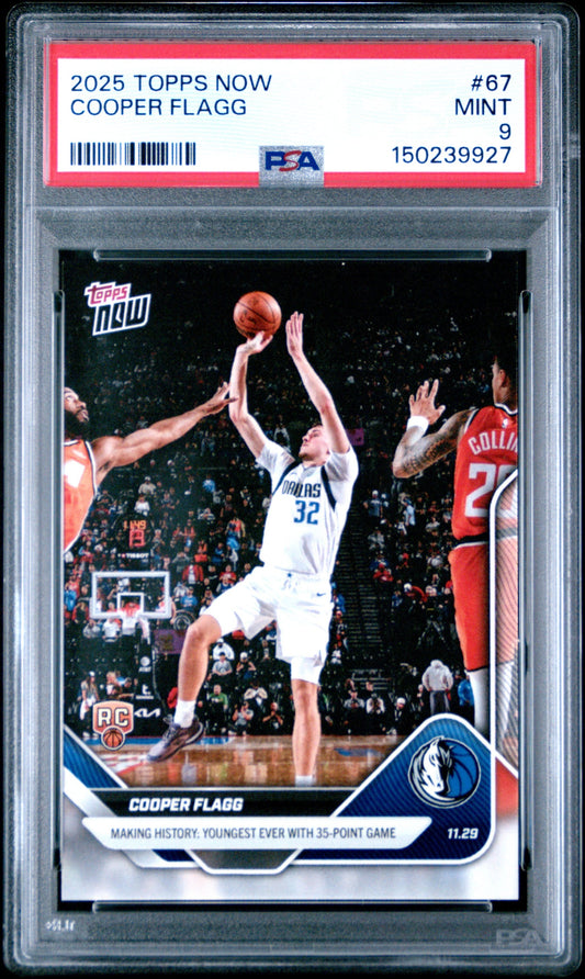 PSA-graded trading card in clear plastic case showing Cooper Flagg shooting basketball in white Dallas uniform, red border label with mint 9 rating visible.