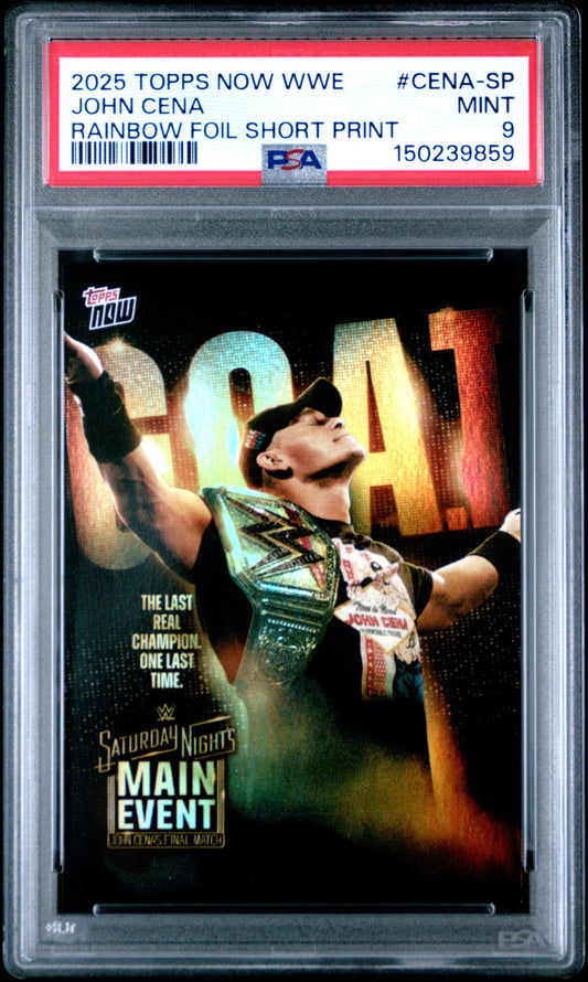 PSA-graded trading card in clear holder showing John Cena holding championship belt with "NOW" text and rainbow foil effect on black background.