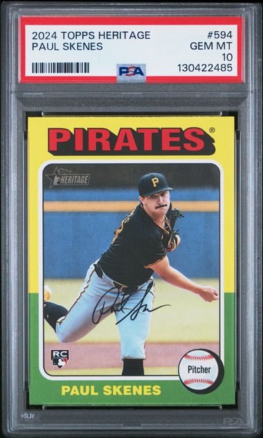 PSA-graded 2024 Topps Heritage Paul Skenes rookie card in clear plastic case, showing yellow Pirates design with pitcher photo and autograph.