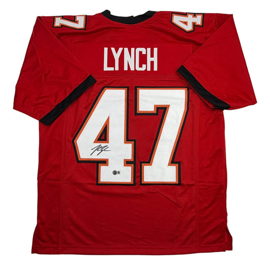 Red Tampa Bay football jersey #47 with Lynch nameplate, displayed flat showing back view with signature on white number.