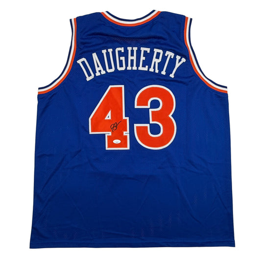 Back view of blue Cleveland Cavaliers basketball jersey number 43 with "DAUGHERTY" nameplate and autograph.