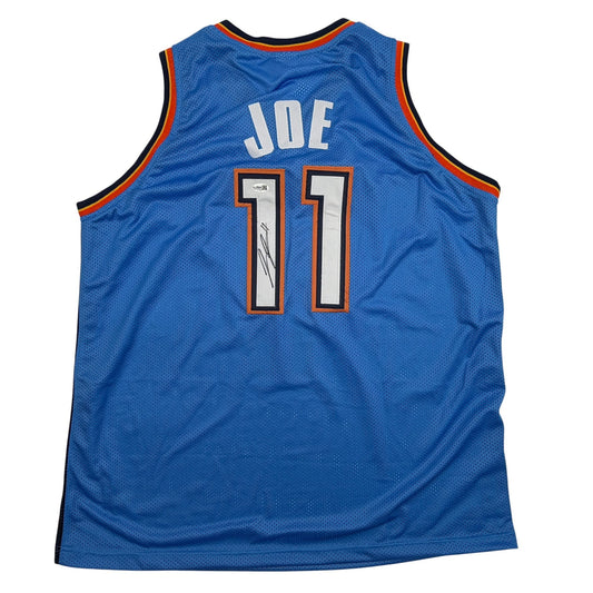 Back view of blue Oklahoma City Thunder basketball jersey number 11 with "JOE" nameplate and autographed number.