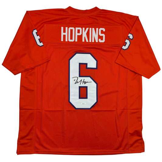 Back view of red Clemson football jersey numbered 6 with "HOPKINS" across shoulders and autographed number patch.
