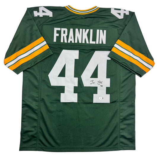 Back view of green and gold Green Bay Packers jersey number 44 with "Franklin" nameplate and autograph visible.