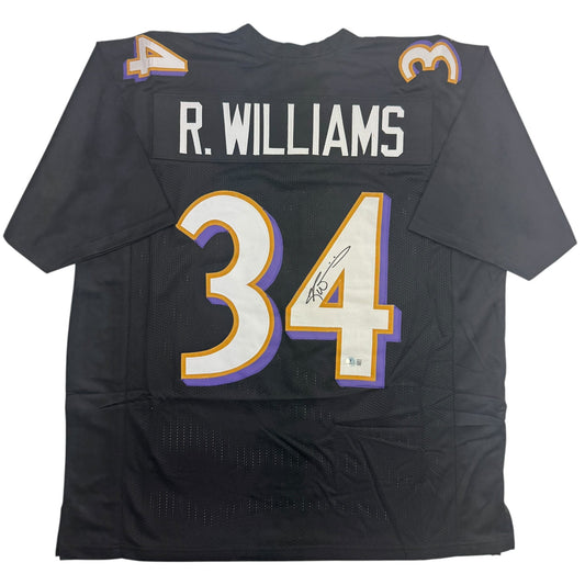Black Baltimore Ravens football jersey #34 with "R. WILLIAMS" nameplate and autographed number, displayed flat lay front view.