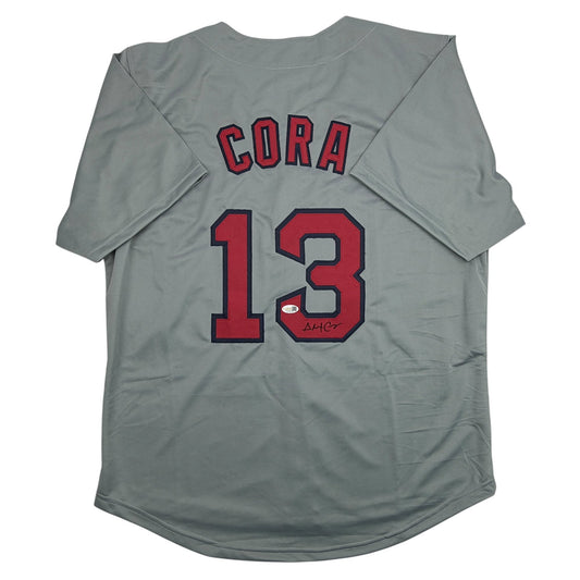 Back view of grey baseball jersey with red "CORA 13" lettering and autographed signature.
