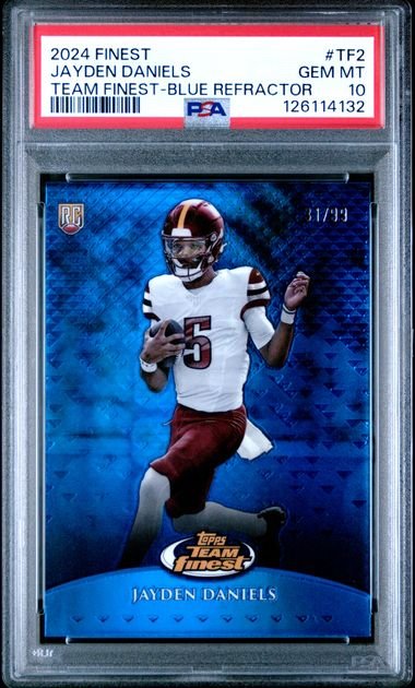 PSA-graded trading card in clear plastic case showing Jayden Daniels in white Commanders jersey on blue refractor background with grade label visible.
