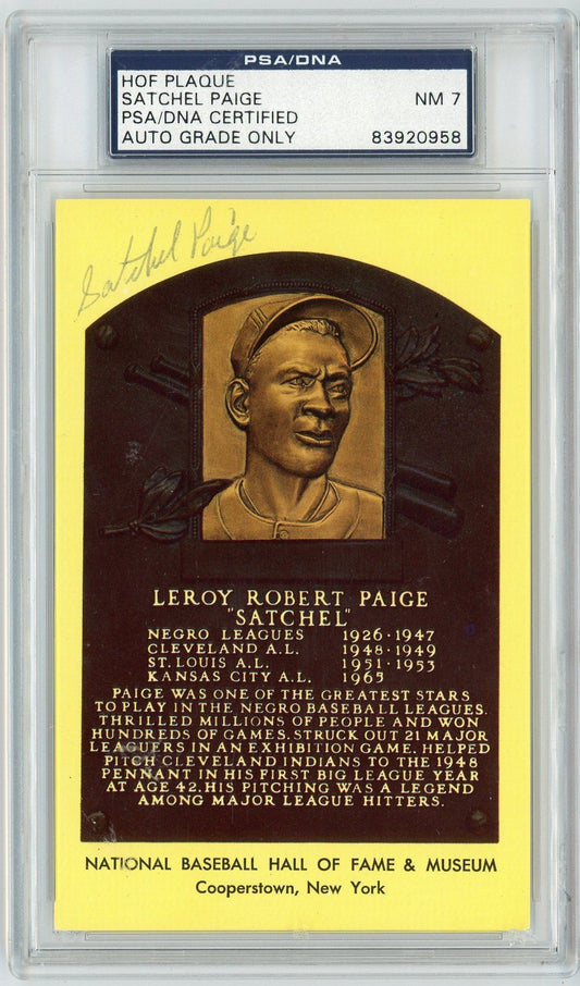 Framed Hall of Fame plaque featuring bronze portrait of Leroy "Satchel" Paige on yellow background with biographical text, signed in black ink.