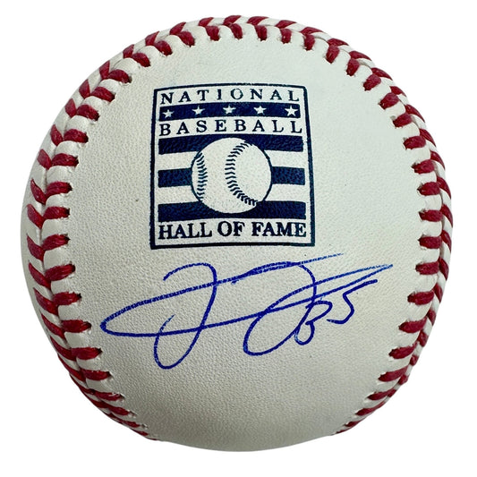 Official National Baseball Hall of Fame baseball with red stitching and blue autographed signature visible on cream-colored leather surface.