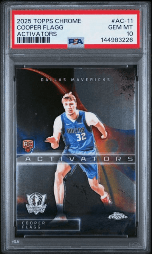 PSA graded card in clear plastic holder showing Cooper Flagg in Dallas Mavericks blue jersey number 32, with red label and grading details visible.