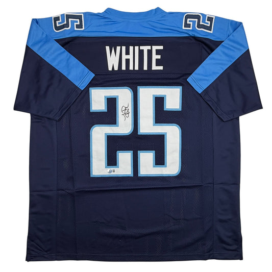 Back view of navy blue football jersey with "WHITE" nameplate, number 25, light blue shoulders, and autograph signature visible on chest.