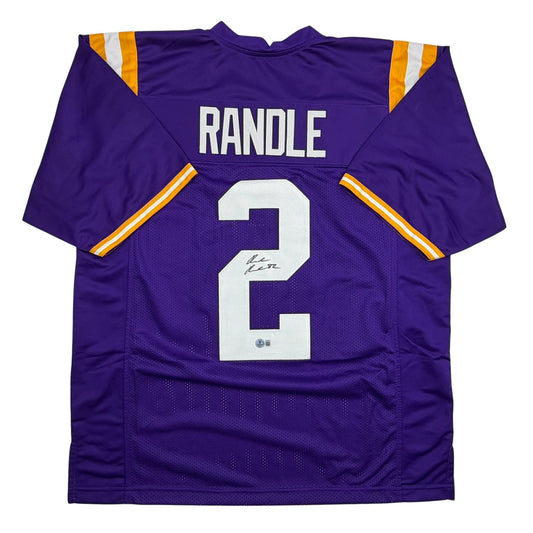 Back view of purple LSU football jersey number 2 with "RANDLE" nameplate and autographed signature on chest.