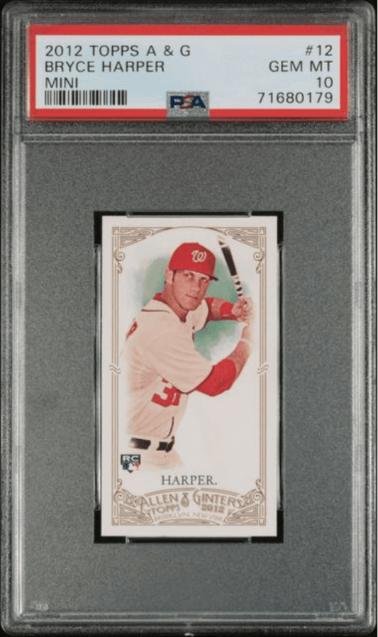 PSA-graded mini baseball card in protective case showing Bryce Harper in red Nationals uniform holding bat against green background.