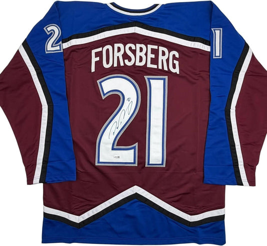 Back view of signed maroon and blue Colorado Avalanche hockey jersey number 21 with "FORSBERG" nameplate.