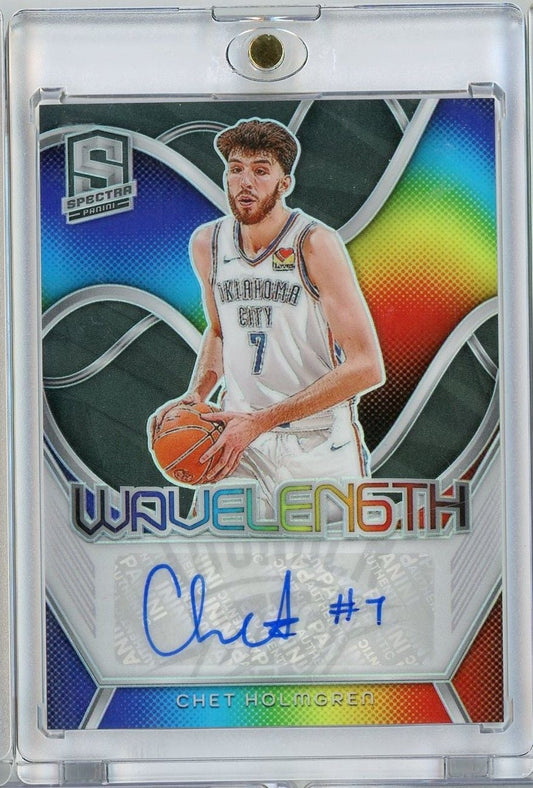 Front view of signed basketball card showing Chet Holmgren in Oklahoma City uniform holding ball against colorful gradient background with blue autograph.