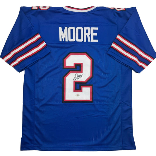 Back view of signed blue football jersey number 2 with Moore nameplate, red and white stripes on sleeves.