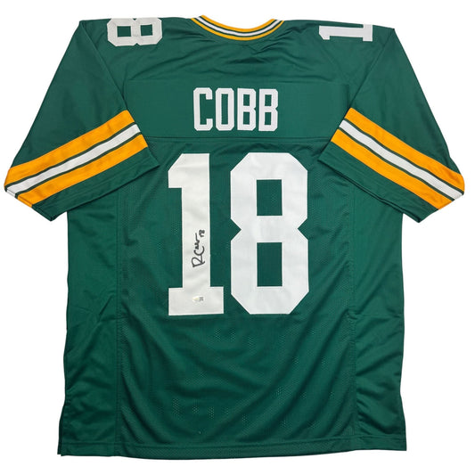 Green Bay Packers #18 jersey with "COBB" nameplate and autographed signature, displayed flat front view.