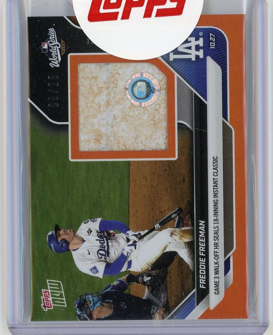 Front of 2025 Topps Now baseball card featuring Freddie Freeman in Dodgers uniform with embedded cream-colored relic swatch under orange border.