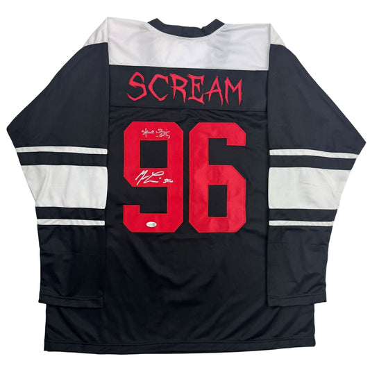 Back view of black hockey jersey with white stripes, red number 96, "SCREAM" text, and dual signatures.