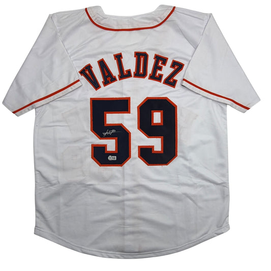 White baseball jersey with "VALDEZ" and number 59 in red and navy lettering, displayed flat against white background.