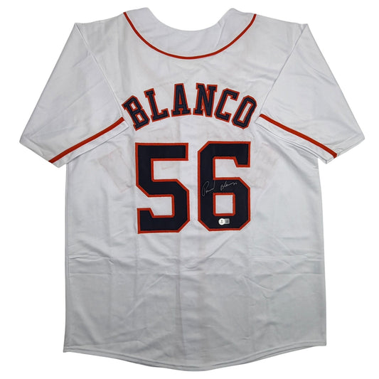 White baseball jersey with "BLANCO" and number "56" in red and navy lettering, displayed flat against white background.