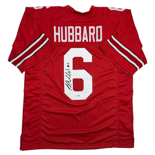 Red Ohio State football jersey with "HUBBARD" and number 6 displayed on white chest panel, showing autographed signature, flat lay view.