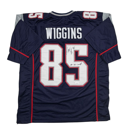 Navy blue football jersey with white number 85 and red trim, displaying "WIGGINS" across the back with visible autograph signatures.