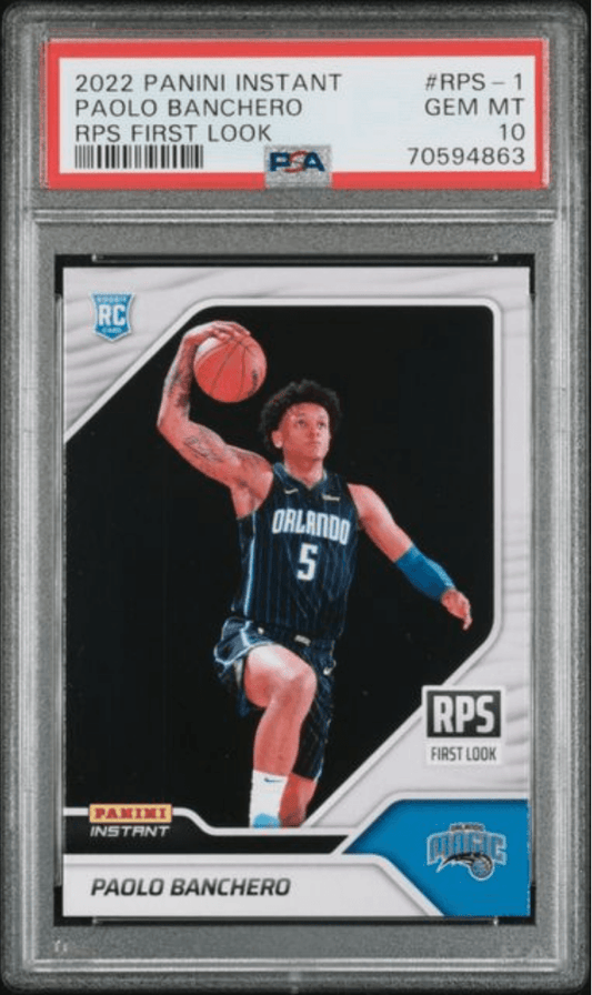 PSA-graded trading card in protective slab showing Paolo Banchero in Orlando Magic uniform shooting basketball, with red label and blue team logo visible.