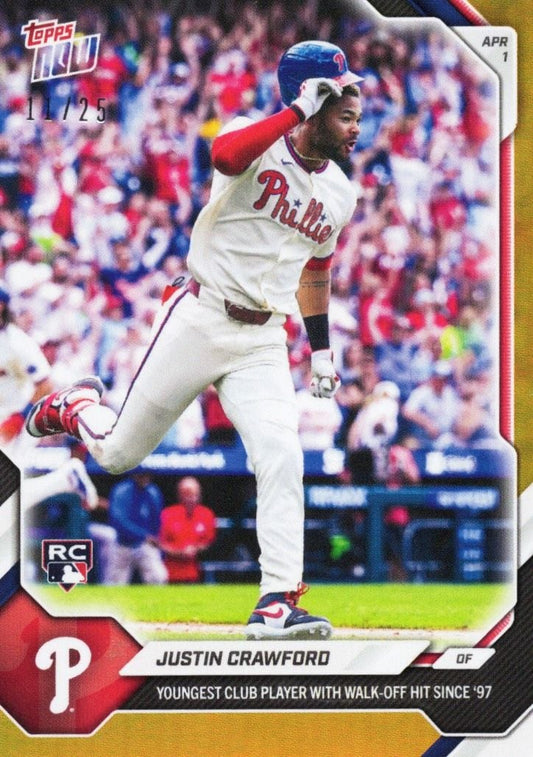 Topps Now baseball card featuring Justin Crawford in Philadelphia Phillies white uniform mid-stride with blue helmet, orange foil border visible.