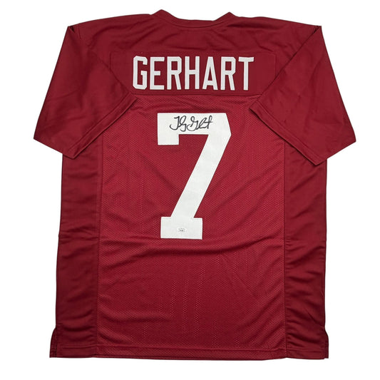 Back view of maroon Stanford football jersey displaying "GERHARDT" and number 7 in white with handwritten signature on number.