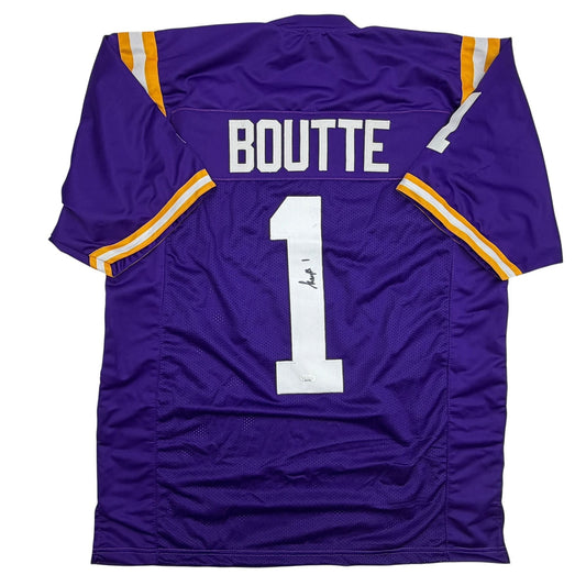 Purple LSU football jersey number 1 with "BOUTTE" nameplate and autographed number 1, displayed flat against white background showing back view.