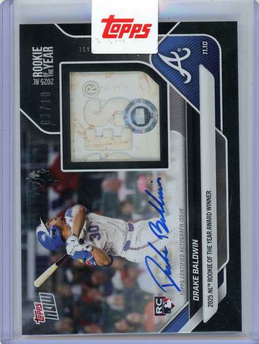 Front of baseball card showing Drake Baldwin in batting stance wearing purple Braves uniform with blue autograph and relic window.
