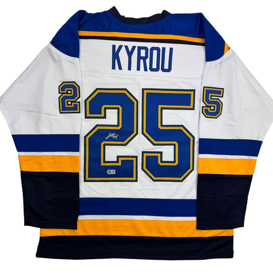 White hockey jersey with blue and gold trim displaying "KYROU" and number 25, shown flat lay from back view.