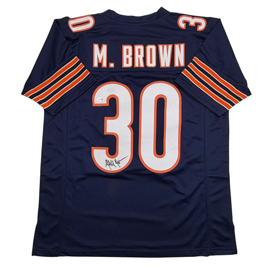 Back view of navy blue Chicago Bears football jersey number 30 with M. Brown nameplate and autographed signature on chest.