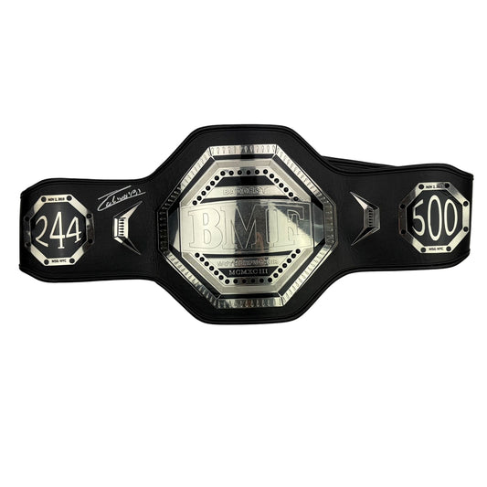 Black leather BMF championship belt with silver octagonal center plate and numbered side plates, displayed flat against white background.