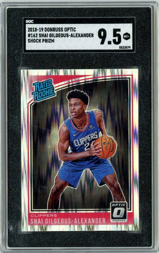 SGC 9.5-graded 2018 Donruss Optic Shai Gilgeous-Alexander rookie card in clear plastic case showing player in blue Clippers uniform holding basketball.