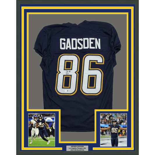 Navy blue football jersey #86 with "GADSDEN" nameplate displayed in framed presentation with accompanying action photographs.