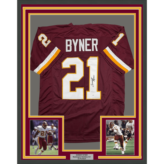 Framed maroon Washington Redskins jersey #21 signed by Earnest Byner, displayed with two action photos and nameplate below.
