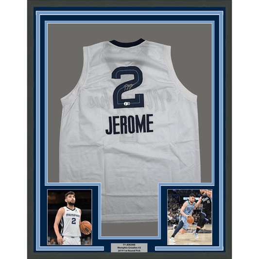White mesh basketball jersey number 2 with "JEROME" printed below, displayed in blue-framed case with player photos and nameplate.