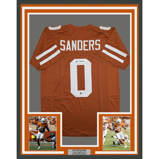 Framed burnt orange Texas Longhorns jersey #0 with "SANDERS" nameplate, flanked by two action photos and authentication details at bottom.