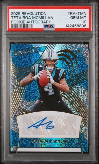 PSA-graded rookie autograph card showing Tetairoa McMillan in blue uniform catching football, with blue holographic background and signed lower section.
