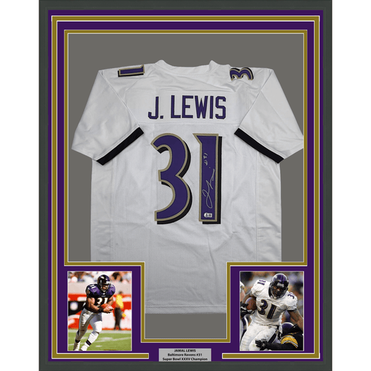 White signed Baltimore Ravens jersey #31 with "J. LEWIS" nameplate displayed in purple and gold frame with two action photos below.