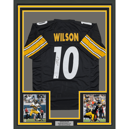 Black Pittsburgh Steelers jersey number 10 with "WILSON" nameplate, signed, displayed in yellow-bordered frame with two action photos below.