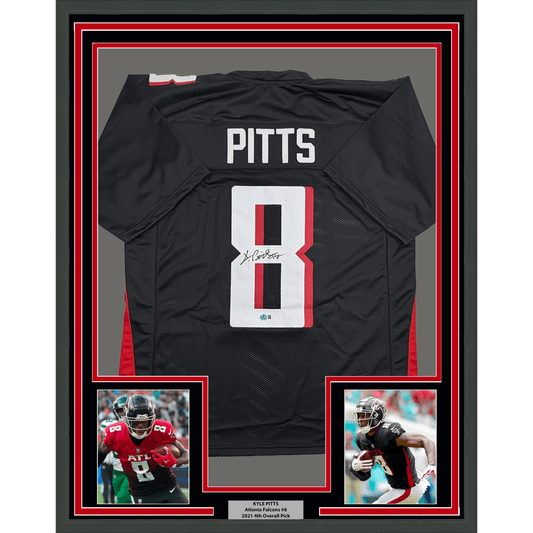 Framed black Kyle Pitts Atlanta Falcons jersey number 8 with autograph, flanked by two action photos, against red and gray matting.