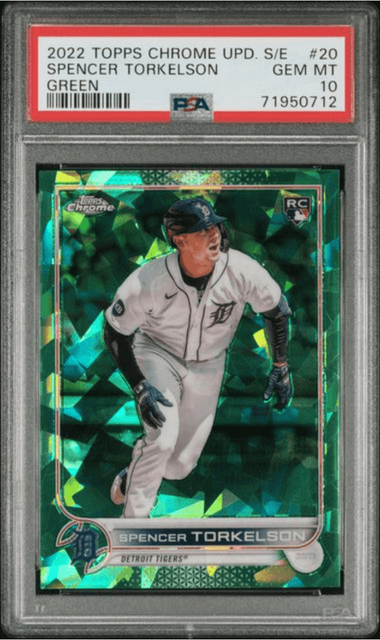 Graded baseball card in PSA slab showing Spencer Torkelson in Detroit Tigers uniform on green holographic background with red label strip.