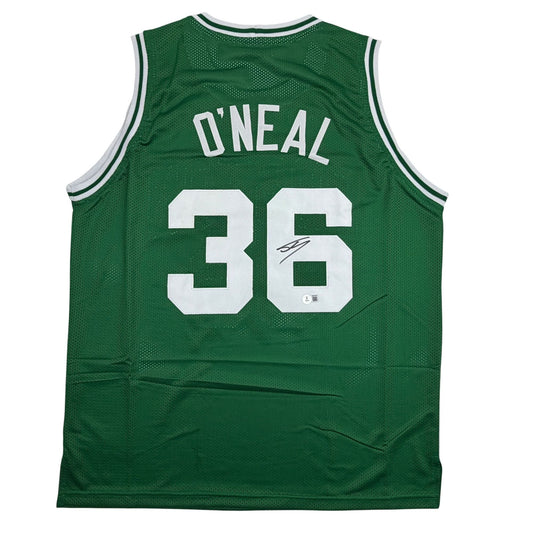 Back view of signed green Celtics basketball jersey number 36 O'Neal in white lettering on mesh fabric.