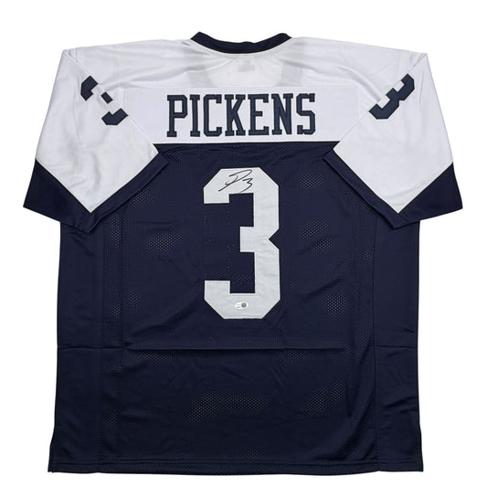 Back view of navy and white football jersey with "PICKENS" and number "3" printed in white, displaying autographed signature on the number.